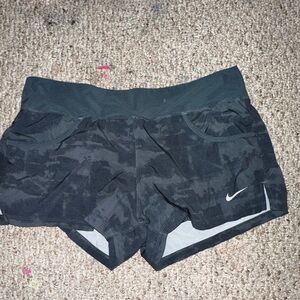 gray Nike running shorts
